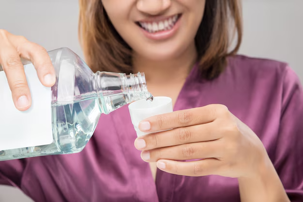 Woman using mouthwash after brushing 46527 121